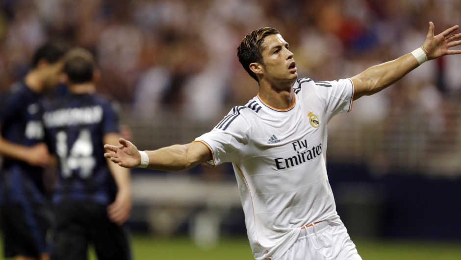 Real Madrid's Cristiano Ronaldo celebrates after scoring during the first half of an exhibition soccer match against Inter Milan Saturday, Aug. 10, 2013, at the Edward Jones Dome in St. Louis. (AP Photo/Jeff Roberson)