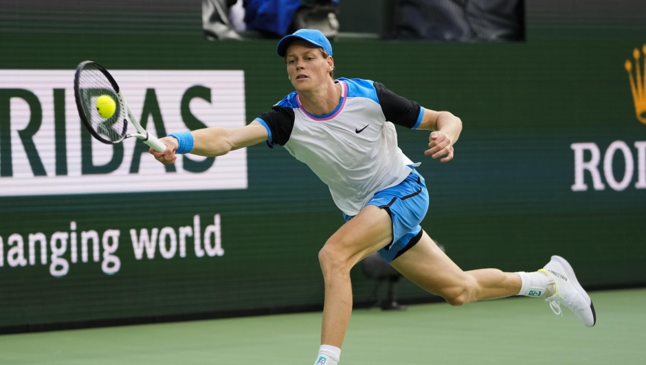 Jannik Sinner, of Italy, returns a shot against Carlos Alcaraz, of Spain, during a semifinal match at the BNP Paribas Open tennis tournament in Indian Wells, Calif., Saturday, March 16, 2024. (AP Photo/Ryan Sun)