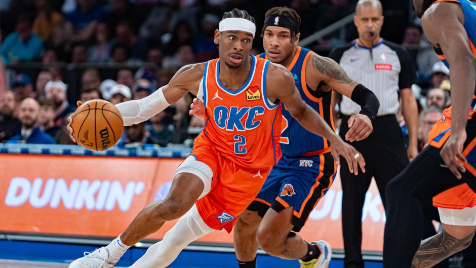 Oklahoma City Thunder's Shai Gilgeous-Alexander (2) drives to the basket ahead of New York Knicks' Miles McBride, rear, during the second half of an NBA basketball game in New York, Sunday, March 31, 2024. (AP Photo/Peter K. Afriyie)