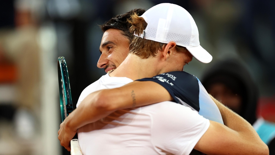 MADRID, SPAIN - APRIL 27: Jannik Sinner of Italy is embraced by Lorenzo Sonego of Italy following victory in the Men's Singles Round of 64 match during Day Five of the Mutua Madrid Open at La Caja Magica on April 27, 2024 in Madrid, Spain. (Photo by Clive Brunskill/Getty Images)