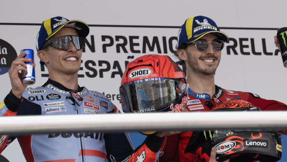 JEREZ DE LA FRONTERA, SPAIN - APRIL 28: (L-R)  Marc Marquez of Spain and Gresini Racing MotoGP, Francesco Bagnaia of Italy and Ducati Lenovo Team and  Marco Bezzecchi of Italy and Pertamina Enduro VR46 Racing Team celebrate on the podium at the end of the  MotoGP race during the MotoGP Of Spain - Race  on April 28, 2024 in Jerez de la Frontera, Spain. (Photo by Mirco Lazzari gp/Getty Images)