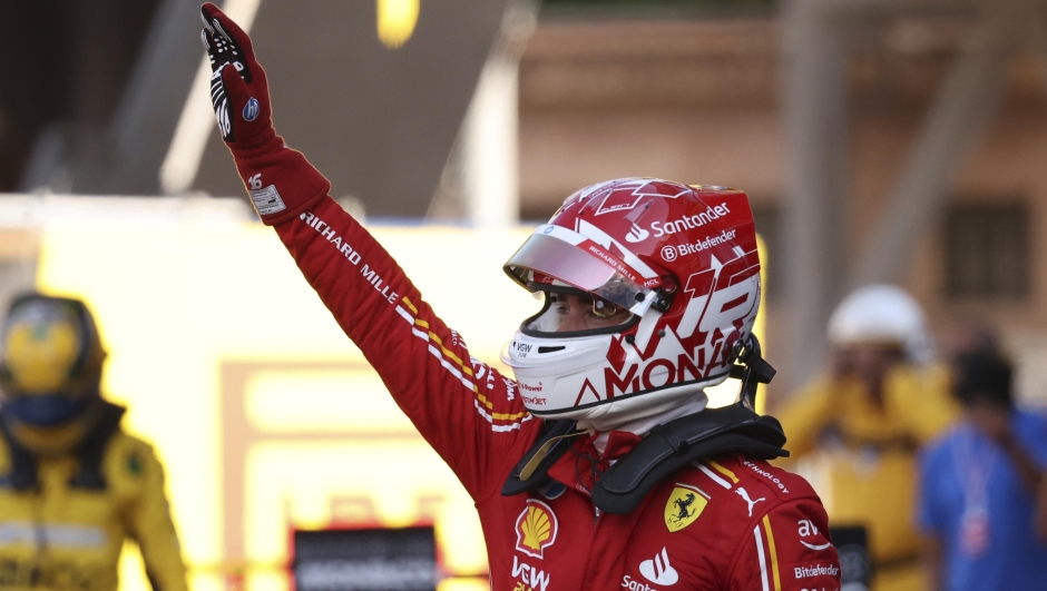 Ferrari driver Charles Leclerc of Monaco celebrates his pole position after the qualifying session ahead of the Formula One Monaco Grand Prix at the Monaco racetrack, in Monaco, Saturday, May 25, 2024. (Claudia Greco/Pool Photo via AP)