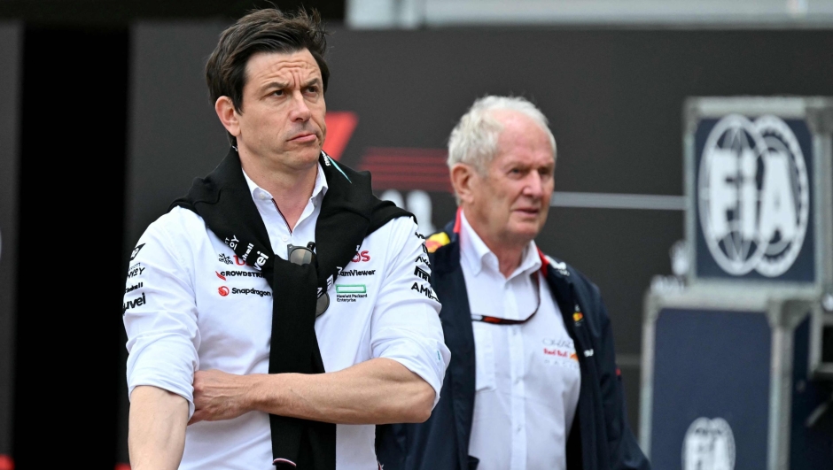 Mercedes' Austrian team principal Toto Wolff (L) and Red Bull Racing's director Helmut Marko arrive in the pits of the Circuit de Monaco before the second practice session of the Formula One Monaco Grand Prix on May 24, 2024, two days ahead of the race. (Photo by ANDREJ ISAKOVIC / AFP)
