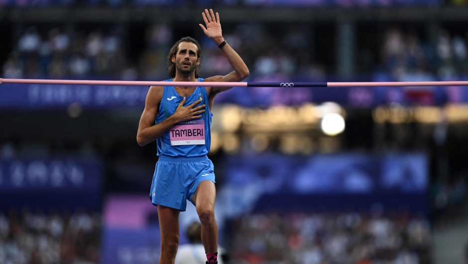 Italy's Gianmarco Tamberi reacts as he competes in the men's high jump final of the athletics event at the Paris 2024 Olympic Games at Stade de France in Saint-Denis, north of Paris, on August 10, 2024. (Photo by Ben STANSALL / AFP)