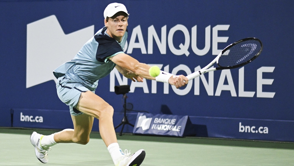 Jannik Sinner, of Italy, plays a shot to Andrey Rublev, of Russia, during their quarterfinal match at the National Bank Open tennis tournament in Montreal, Saturday, Aug. 10, 2024. (Graham Hughes/The Canadian Press via AP)