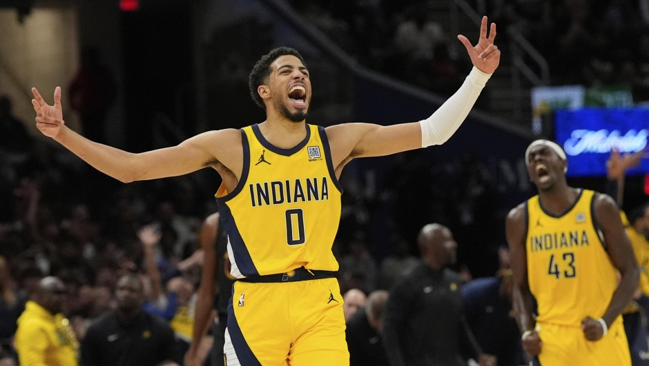 Indiana Pacers guard Tyrese Haliburton, left, celebrates along with forward Pascal Siakam after scoring during the second half in Game 5 of an Eastern Conference semifinal NBA basketball playoff against the Cleveland Cavaliers, Tuesday, May 13, 2025, in Cleveland. (AP Photo/Sue Ogrocki)