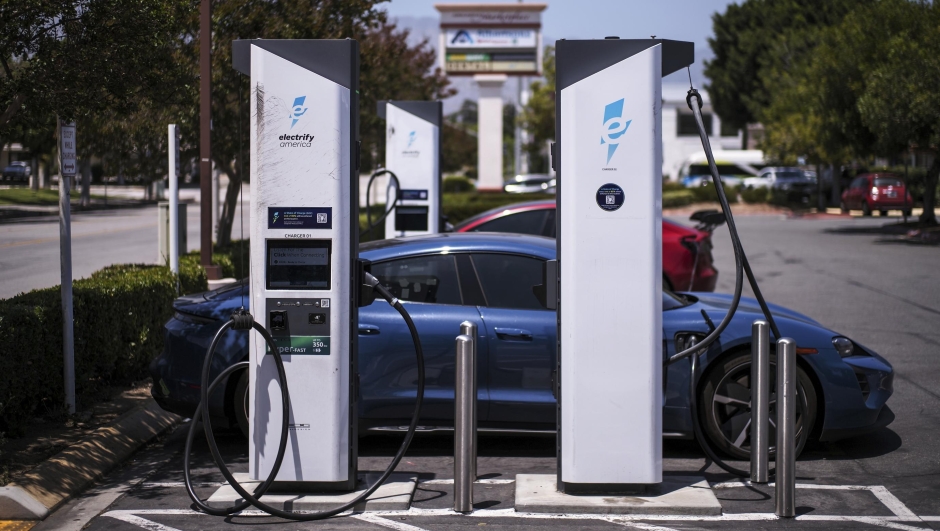 An electric vehicle charges at an Electrify America station in Arcadia, Calif., Thursday, May 22, 2025. (AP Photo/Jae C. Hong)