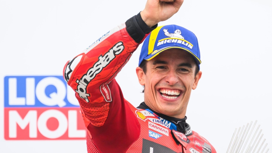 Winner Marc Marquez from Spain from the Ducati Lenovo Team celebrates on the podium following the MotoGP race, German Grand Prix, at the Sachsenring circuit, in Hohenstein-Ernstthal, Germany, Sunday July 13, 2025. (Robert Michael/dpa via AP) Associated Press / LaPresse Only italy and spain