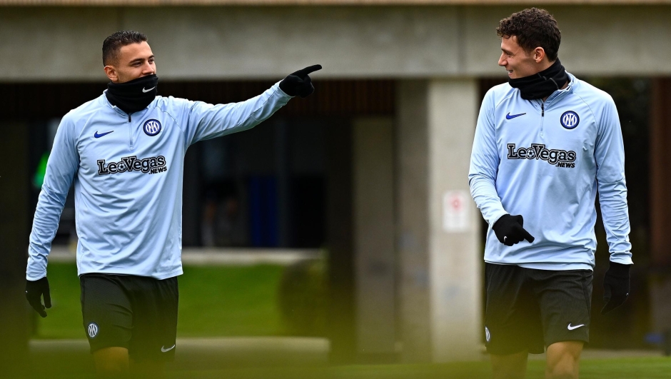 Kristjan Asllani of FC Internazionale and Benjamin Pavard of FC Internazionale looks on during the FC Internazionale training session at the club's training ground Suning Training Center at Appiano Gentile on February 24, 2024 in Como, Italy. (Photo by Mattia Ozbot - Inter/Inter via Getty Images)