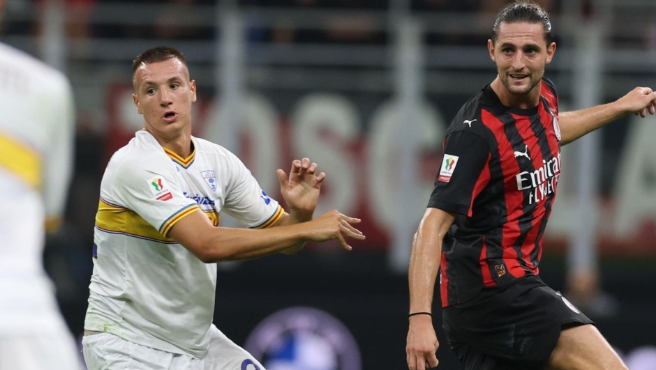   Adrien Rabiot of AC Milan competes for the ball with Danilo Veiga of US Lecce during the Coppa Italia match between AC Milan and US Lecce at Giuseppe Meazza Stadium on September 23, 2025 in Milan, Italy. (Photo by Claudio Villa/AC Milan via Getty Images)