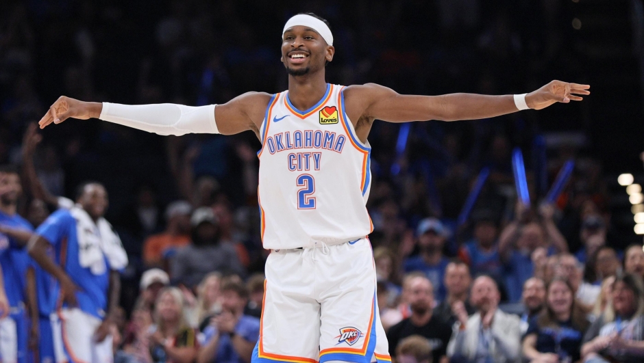 Oklahoma City Thunder guard Shai Gilgeous-Alexander reacts after a teammate scored during the first half of a preseason NBA basketball game against the Charlotte Hornets, Thursday, Oct. 9, 2025, in Oklahoma City. (AP Photo/Nate Billings)