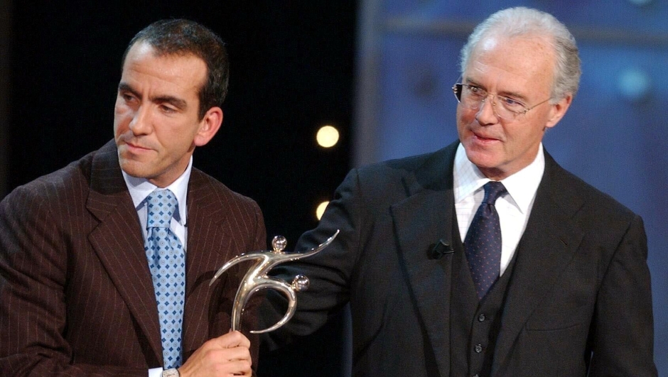 Paolo di Canio, left, from Italy  poses with his trophy for the FIFA fair play award with Franz Beckenbauer, right, at the the  FIFA World Player trophy 2001 Gala  in Zuerich, Switzerland, on Monday,  December 17 2001. ANSA /WALTER BIERI
