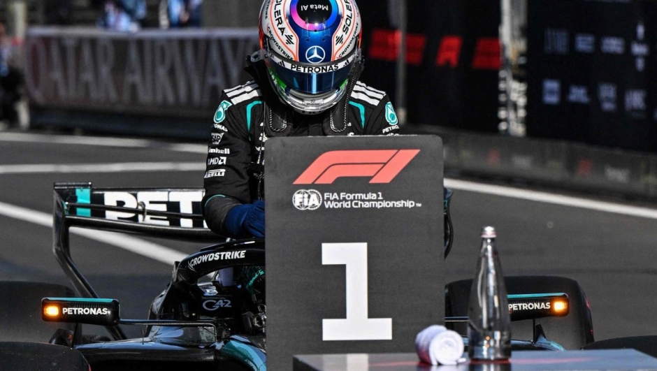 Mercedes' Italian driver Kimi Antonelli exits his car after taking the pole position during the qualifying session ahead of the Formula One Chinese Grand Prix at the Shanghai International Circuit in Shanghai on March 14, 2026. (Photo by Hector RETAMAL / AFP)