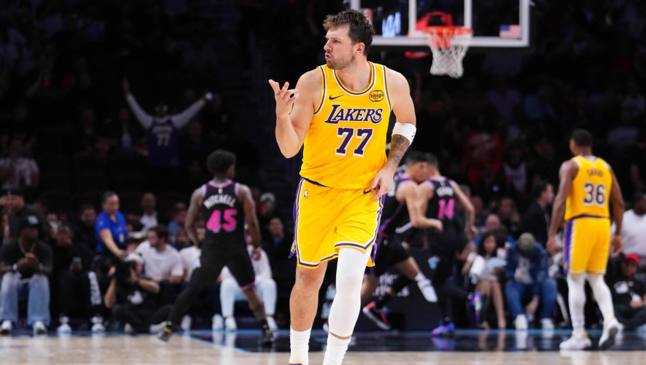  Luka Doncic #77 of the Los Angeles Lakers reacts after scoring a three-pointer against the Miami Heat during the third quarter at Kaseya Center on March 19, 2026 in Miami, Florida. NOTE TO USER: User expressly acknowledges and agrees that, by downloading and or using this photograph, User is consenting to the terms and conditions of the Getty Images License Agreement.   Rich Storry/Getty Images/AFP (Photo by Rich Storry / GETTY IMAGES NORTH AMERICA / Getty Images via AFP)