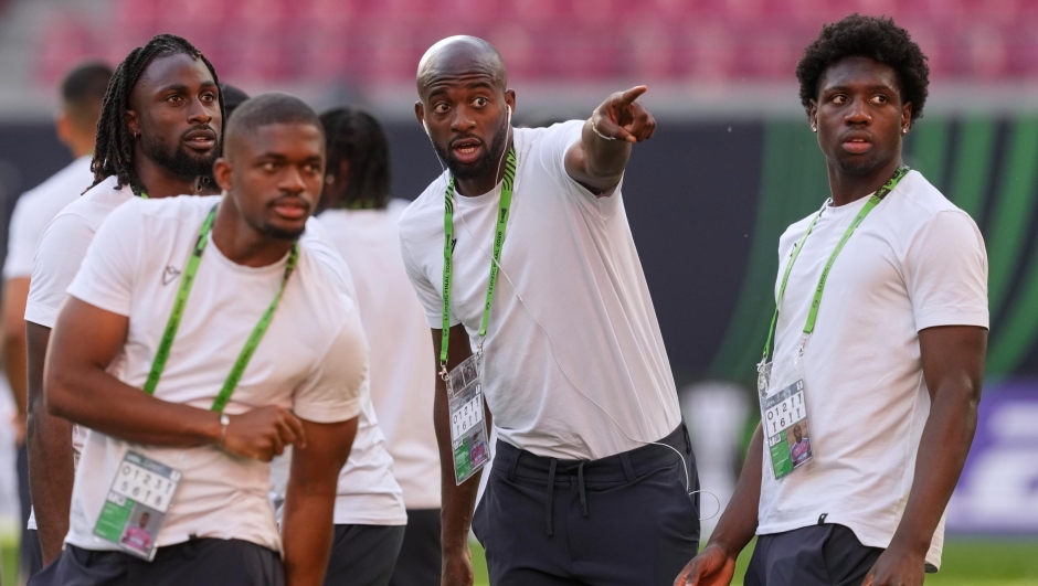 From left, Crystal Palace's Evann Guessand, Cheick Doucoure, Jean-Philippe Mateta and Jaydee Canvot talk during a walk around the stadium ahead of the Europa Conference League final soccer match against Rayo Vallecano in Leipzig, Germany, Tuesday, May 26, 2026. (AP Photo/Michael Probst)