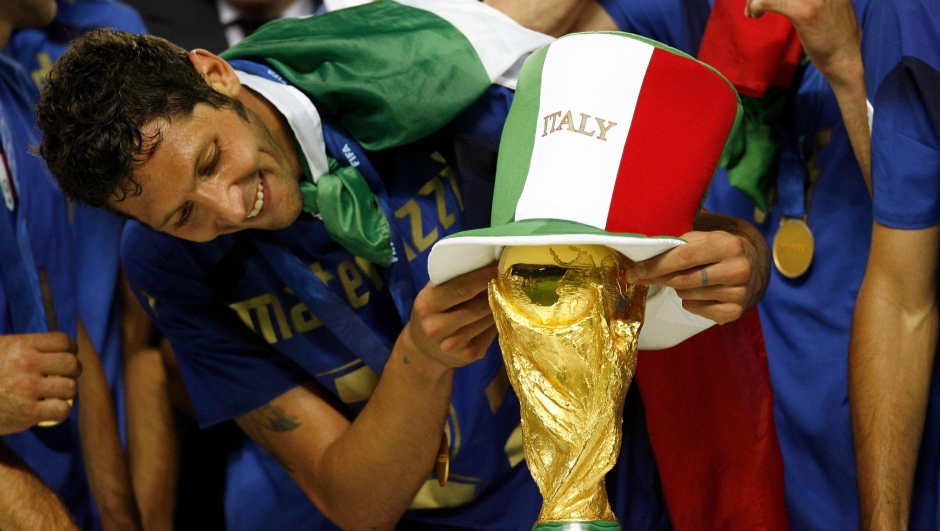   Marco Materazzi of Italy places an Italian hat onto the world cup trophy during the FIFA World Cup Germany 2006 Final match between Italy and France at the Olympic Stadium on July 9, 2006 in Berlin, Germany.
  (Photo by Michael Steele/Getty Images)
