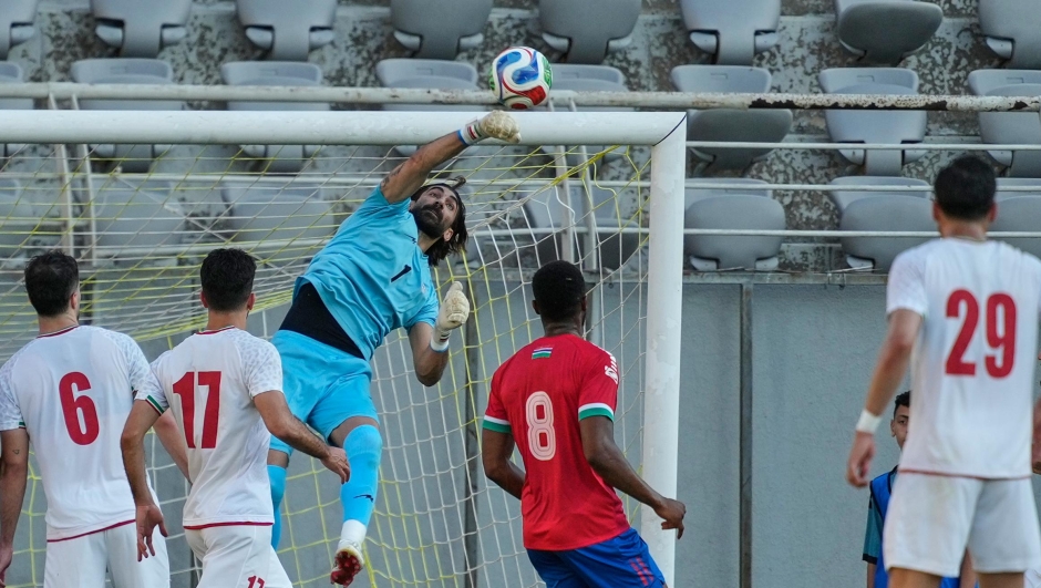 Iran's goalkeeper Alireza Beiranvand punches the ball clear during a friendly soccer match between Iran and Gambia, in Antalya, southern Turkey, Friday, May 29, 2026. (AP Photo/Khalil Hamra)