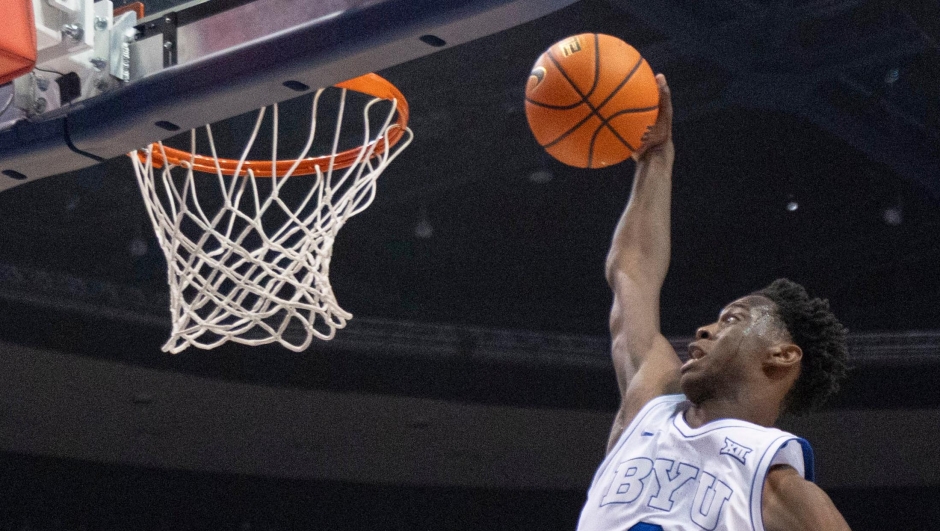 FILE - BYU forward AJ Dybantsa (3) prepares to dunk the ball against Eastern Washington during the first half of an NCAA college basketball game, Monday, Dec. 22, 2025, in Provo, Utah. (AP Photo/Rob Gray, File)