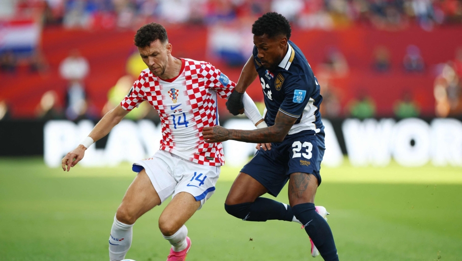 Croatia's forward #14 Ivan Perisic and Panama's defender #23 Michael Amir Murillo fight for the ball during the 2026 World Cup Group L football match between Panama and Croatia at the Toronto Stadium in Toronto on June 23, 2026.  (Photo by Cole Burston / AFP)