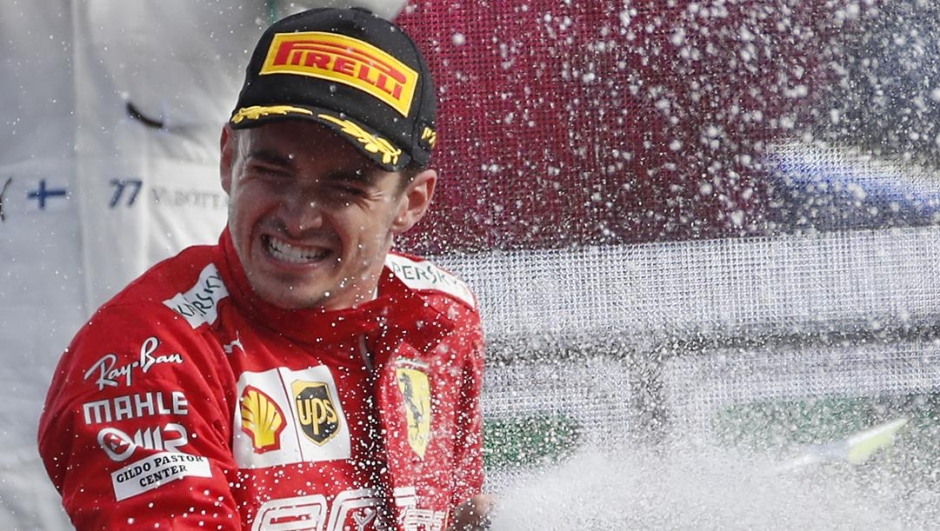 Charles Leclerc esulta sul podio di Monza. AP