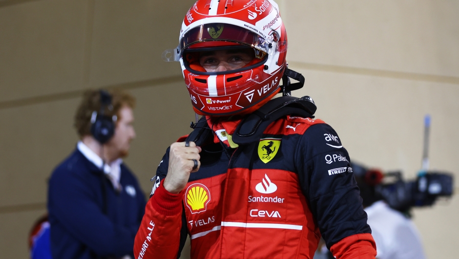 BAHRAIN, BAHRAIN - MARCH 19: Pole position qualifier Charles Leclerc of Monaco and Ferrari celebrates in parc ferme during qualifying ahead of the F1 Grand Prix of Bahrain at Bahrain International Circuit on March 19, 2022 in Bahrain, Bahrain. (Photo by Lars Baron/Getty Images)