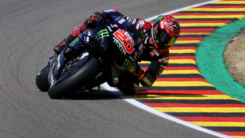 Monster Energy Yamaha's French rider Fabio Quartararo steers his motorbike during the qualifying session of the MotoGP German motorcycle Grand Prix at the Sachsenring racing circuit in Hohenstein-Ernstthal near Chemnitz, eastern Germany, on June 18, 2022. (Photo by Ronny Hartmann / AFP)