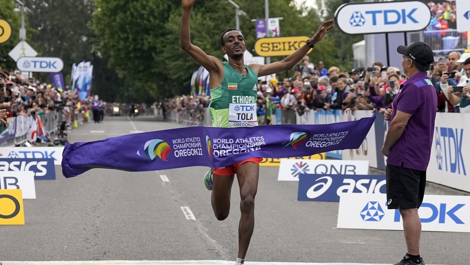 Tamirat Tola, of Ethiopia, celebrates after winning the men's marathon at the World Athletics Championships on Sunday, July 17, 2022, in Eugene, Ore. (AP Photo/Gregory Bull)