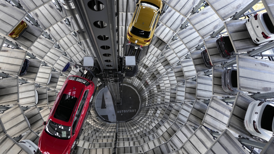 File---File photo shows cars ready for handing over inside one of in total two 'car towers' at the Volkswagen car factory in Wolfsburg, Germany, Monday, Nov. 8, 2021. (AP Photo/Michael Sohn, file)
