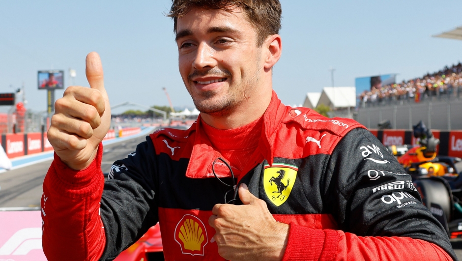 Ferrari's Monegasque driver Charles Leclerc reacts after he took the pole position during the qualifying session ahead of the French Formula One Grand Prix at the Circuit Paul Ricard in Le Castellet, southern France, on July 23, 2022. (Photo by ERIC GAILLARD / POOL / AFP)