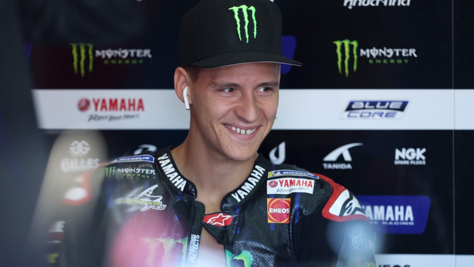 Monster Energy Yamaha's French rider Fabio Quartararo smiles in his box during the second MotoGP free practice session ahead of the German motorcycle Grand Prix at the Sachsenring racing circuit in Hohenstein-Ernstthal near Chemnitz, eastern Germany, on June 17, 2022. (Photo by Ronny Hartmann / AFP)