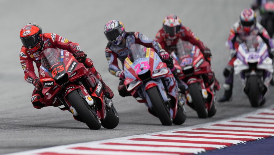 Italy's Francesco Bagnaia rides his Ducati leads Italy's Enea Bastianini rides his Ducati and Australia's Jack Miller rides his Ducati during the Moto GP race as part of the Austrian motorcycle Grand Prix at the Red Bull Ring in Spielberg, Austria, Sunday, Aug. 21, 2022. (AP Photo/Florian Schroetter)