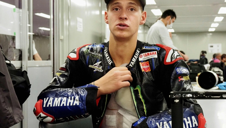 Monster Energy Yamaha MotoGP rider Fabio Quartararo of France speaks to a journalist following his media scrum after the MotoGP class qualifying of MotoGP Japanese Grand Prix at the Mobility Resort Motegi in Motegi, Tochigi prefecture on September 24, 2022. (Photo by Toshifumi KITAMURA / AFP)