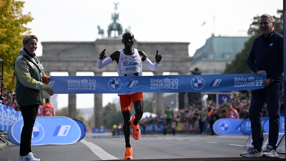 CORRECTION / TOPSHOT - Kenya's Eliud Kipchoge crosses the finish line to win the Berlin Marathon race on September 25, 2022 in Berlin. - Kipchoge has beaten his own world record by 30 seconds, running 2:01:09 at the Berlin Marathon. (Photo by Tobias SCHWARZ / AFP) / The erroneous mention[s] appearing in the metadata of this photo by Tobias SCHWARZ has been modified in AFP systems in the following manner: [Kipchoge has beaten his own world record by 30 seconds, running 2:01:09 at the Berlin Marathon] instead of [Kipchoge has beaten his own world record by 29 seconds, running 2:01:10 at the Berlin Marathon.]. Please immediately remove the erroneous mention[s] from all your online services and delete it (them) from your servers. If you have been authorized by AFP to distribute it (them) to third parties, please ensure that the same actions are carried out by them. Failure to promptly comply with these instructions will entail liability on your part for any continued or post notification usage. Therefore we thank you very much for all your attention and prompt action. We are sorry for the inconvenience this notification may cause and remain at your disposal for any further information you may require.