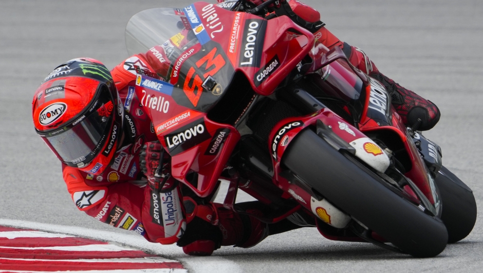 Italian rider Francesco Bagnaia of the Ducati Lenovo Team steers his motorcycle during the third practices for the Malaysia Motorcycle Grand Prix in Sepang International Circuit, Saturday, Oct. 22, 2022. (AP Photo/Vincent Thian)