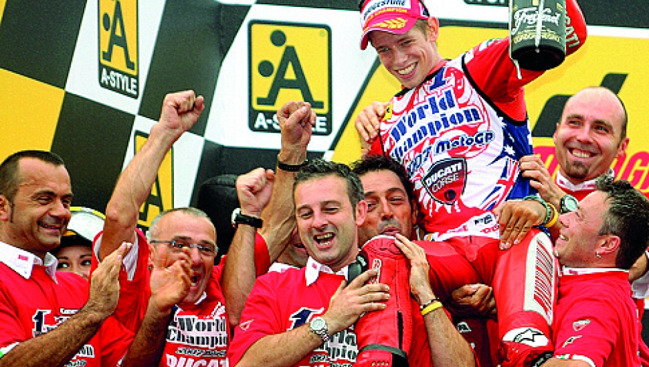 Casey Stoner of Australia, Ducati Marlboro team, is lifted by his team members as he celebrates his first world motorcycling championship title at the Japanese Grand Prix in Twin Ring Motegi, 23 September 2007.  Stoner won his first world motorcycling championship by finishing ahead of his archrival Valentino Rossi in the MotoGP race at the Japanese Grand Prix.   AFP PHOTO / KAZUHIRO NOGI