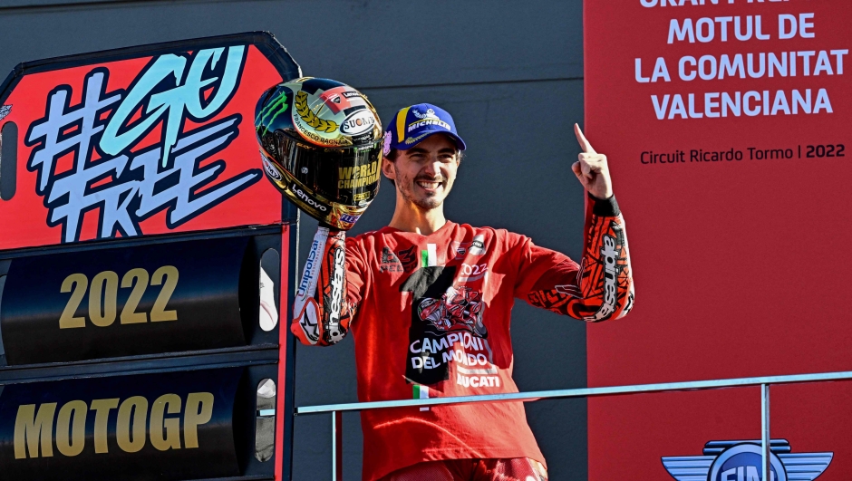 Ducati Italian rider Francesco Bagnaia celebrates as he won the World Championship's title after the Valencia MotoGP Grand Prix race at the Ricardo Tormo racetrack in Cheste, near Valencia, on November 6, 2022. (Photo by JAVIER SORIANO / AFP)
