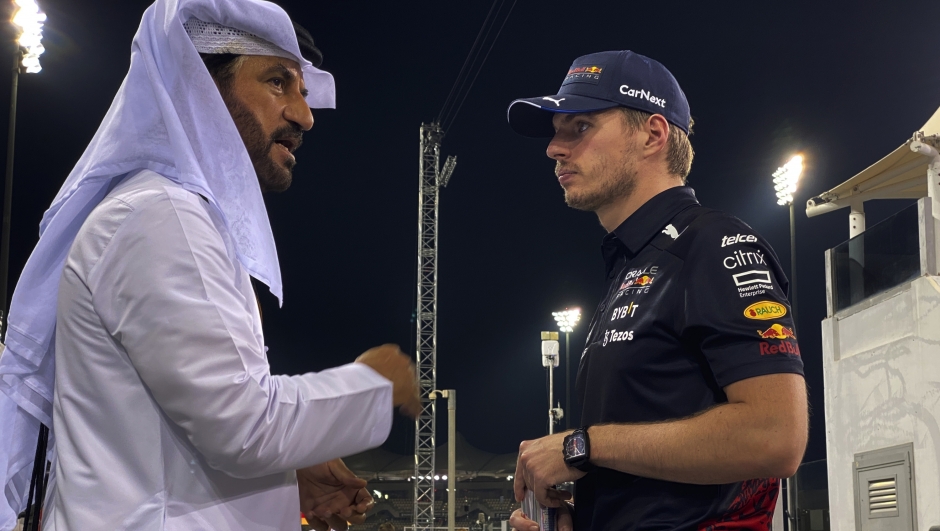 Max Verstappen of the Netherlands and Oracle Red Bull Racing, right, listens to Mohammed Ben Sulayem, former president of the Emirates Motorsports, ahead of the F1 Grand Prix of Abu Dhabi at Yas Marina Circuit in Abu Dhabi, United Arab Emirates, Thursday, Nov. 17, 2022. The Emirates Formula One Grand Prix will take place on Sunday. (AP Photo/Kamran Jebreili)