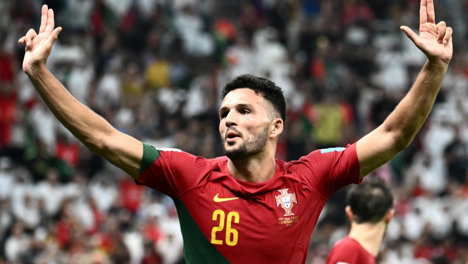 TOPSHOT - Portugal's forward #26 Goncalo Ramos celebrates after scoring his team's fifth goal, his hat-trick, during the Qatar 2022 World Cup round of 16 football match between Portugal and Switzerland at Lusail Stadium in Lusail, north of Doha on December 6, 2022. (Photo by Jewel SAMAD / AFP)