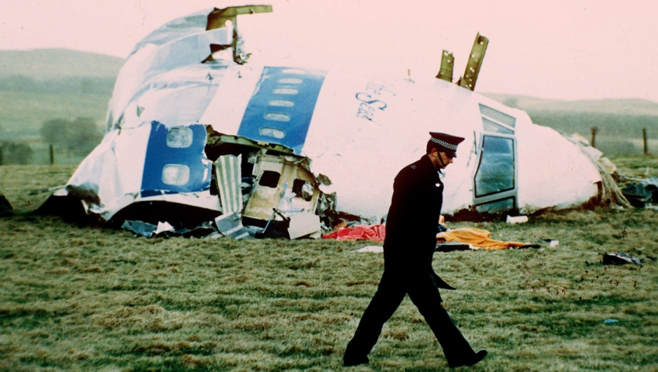FILE--A police officer walks by the nose of Pan Am flight103 in a field near the town of Lockerbie, Scotland where it lay after a bomb aboard exploded, killing a total of 270 people, in this Dec. 21, 1988 file photo. Scottish High Court judges will hand down the long-awaited verdict of the  Lockerbie bombing trial Wednesday Jan. 31,  2001 the court sitting at Camp Zeist in the Netherlands said . (AP Photo/Martin Cleaver)