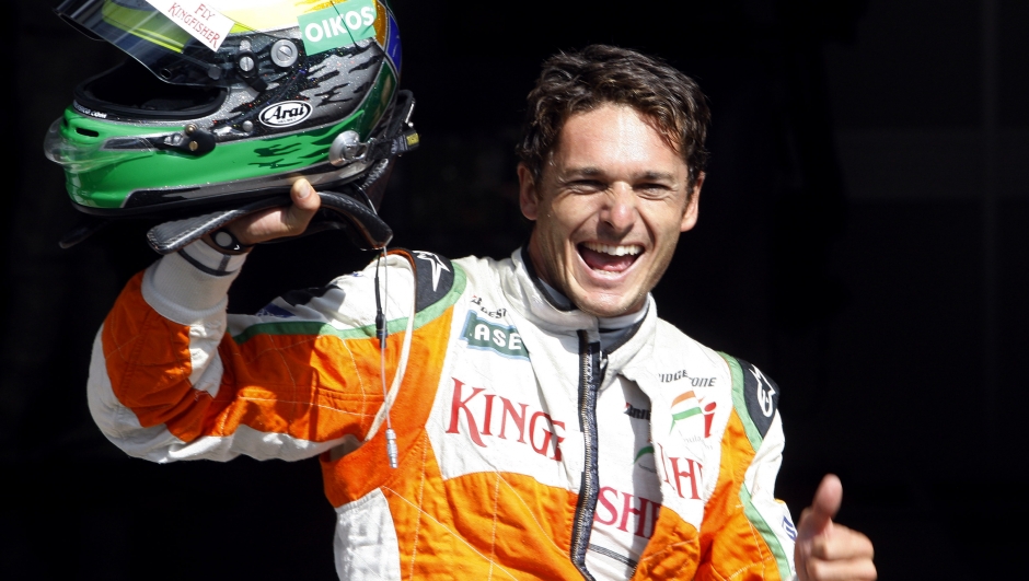 Force India driver Giancarlo Fisichella of Italy reacts after claiming pole position after the qualifying session ahead of Belgium'a Formula One Grand Prix in Spa-Francorchamps circuit, Belgium, Saturday, Aug. 29, 2009. (AP Photo/Luca Bruno)