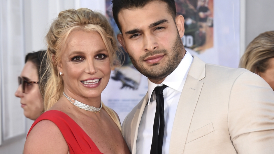 FILE - Britney Spears and Sam Asghari appear at the Los Angeles premiere of "Once Upon a Time in Hollywood" on July 22, 2019. Spears has married her longtime partner Sam Asghari at a Southern California ceremony that came months after the pop superstar won her freedom from a court conservatorship. Asghari?s representative Brandon Cohen confirmed the couple?s nuptials. (Photo by Jordan Strauss/Invision/AP, File)