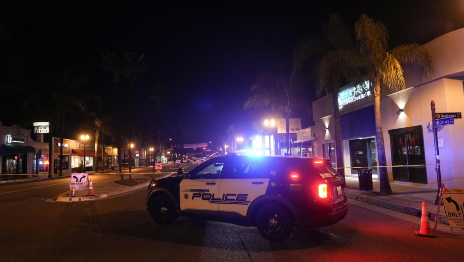 A police vehicle is seen near a scene where a shooting took place in Monterey Park, Calif., Sunday, Jan. 22, 2023. Dozens of police officers responded to reports of a shooting that occurred after a large Lunar New Year celebration had ended in a community east of Los Angeles late Saturday. (AP Photo/Jae C. Hong)