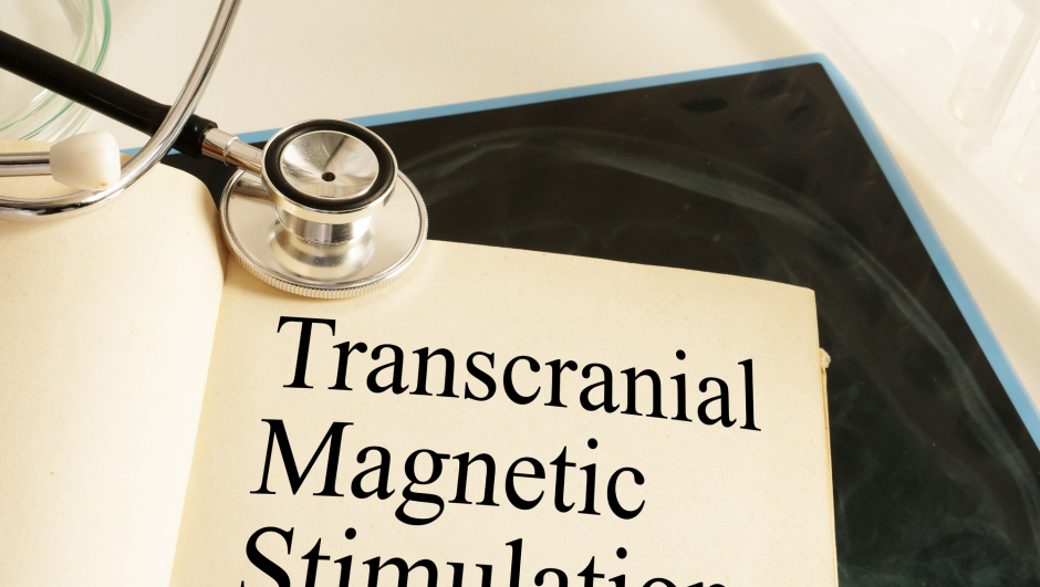 Transcranial Magnetic Stimulation TMS is shown on a photo using the text