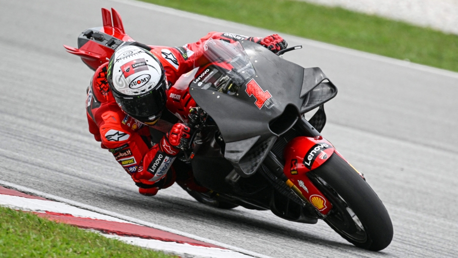 Ducati Lenovo's Italian rider Francesco Bagnaia takes a corner during the second day of the pre-season MotoGP winter test at the Sepang International Circuit in Sepang on February 11, 2023. (Photo by Mohd RASFAN / AFP)