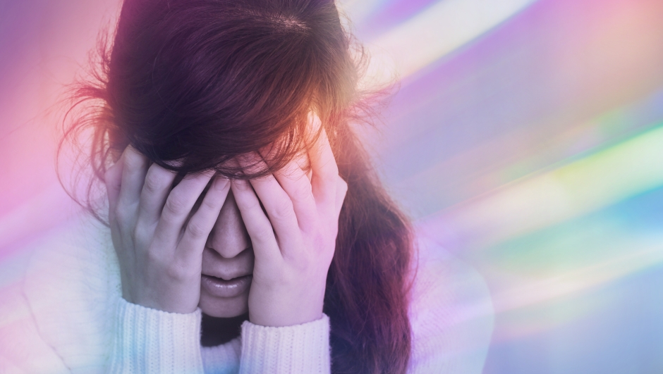 Migraine aura - Portrait of young woman suffering from headache, epilepsy or other problem