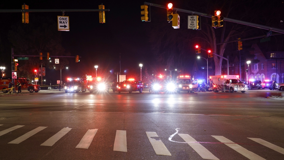Emergency vehicles block an entrance to Michigan State University early Tuesday, Feb. 14, 2023, in East Lansing, Mich. A gunman opened fire Monday night at Michigan State University, killing three people and wounding five more, before fatally shooting himself after an hours-long manhunt that forced frightened students to hide in the dark. (AP Photo/Al Goldis)