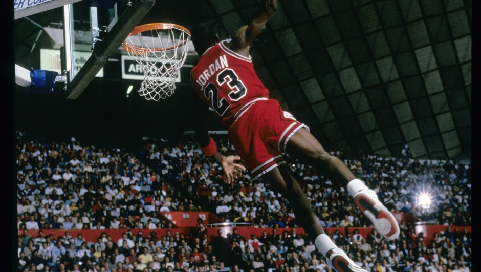 CIRCA 1987:  Michael Jordan #23 of the Chicago Bulls goes for the slam dunk during a circa 1987 NBA basketball game. Jordan played for the Bulss from 1984-93 and 1995 - 98. (Photo by Focus on Sport/Getty Images)