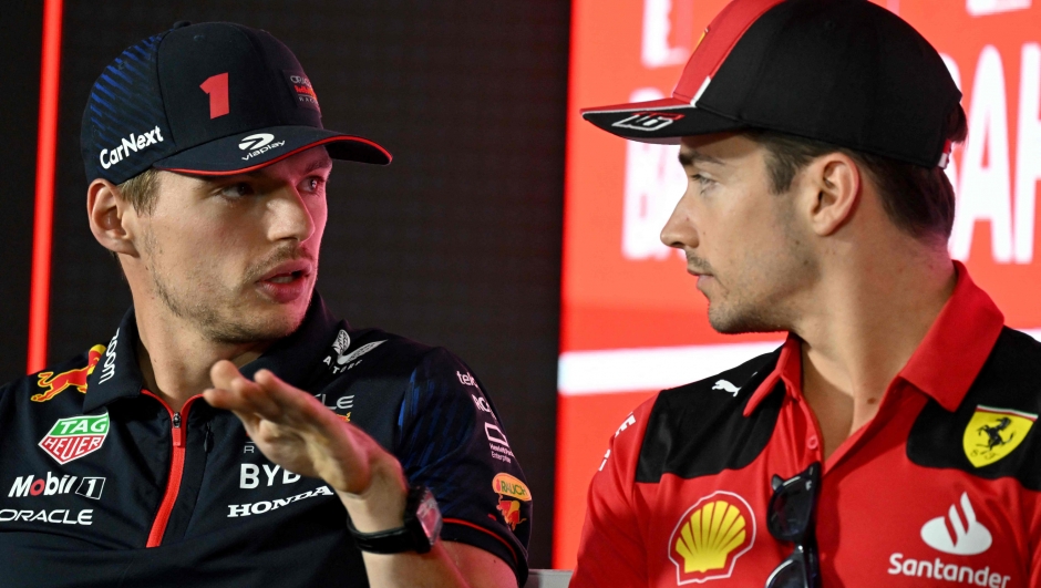 Red Bull Racing's Dutch driver Max Verstappen (L) speaks with Ferrari's Monegasque driver Charles Leclerc during a press conference at the Bahrain International Circuit in Sakhir ahead of the Bahrain Formula One Grand Prix on March 2, 2023. (Photo by ANDREJ ISAKOVIC / AFP)