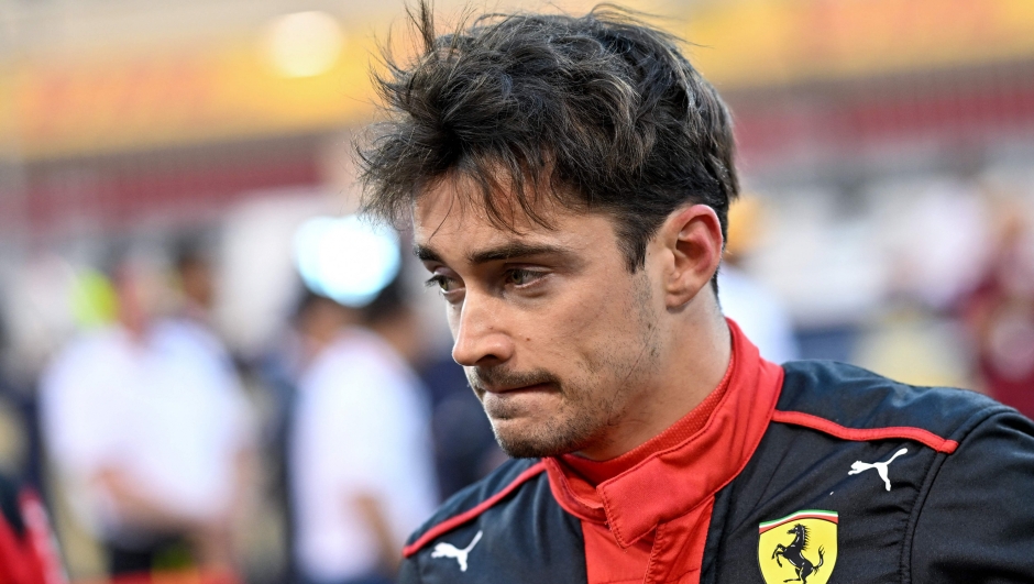 Ferrari's Monegasque driver Charles Leclerc arrives on the racetrack before the Bahrain Formula One Grand Prix at the Bahrain International Circuit in Sakhir on March 5, 2023. (Photo by ANDREJ ISAKOVIC / AFP)