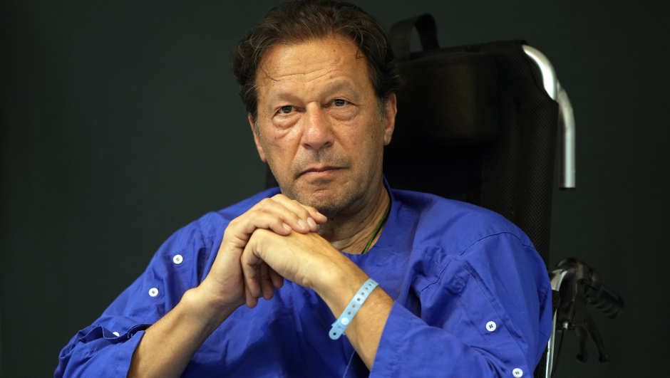 FILE - Former Pakistani Prime Minister Imran Khan speaks during a news conference in Shaukat Khanum hospital, where is being treated for a gunshot wound in Lahore, Pakistan, on Nov. 4, 2022.  Pakistani police used water cannons and fired tear gas to disperse supporters of Khan Wednesday, March 8, 2023,  in the eastern city of Lahore. Two dozen Khan supporters were arrested for defying a government ban on holding rallies, police said. (AP Photo/K.M. Chaudhry)